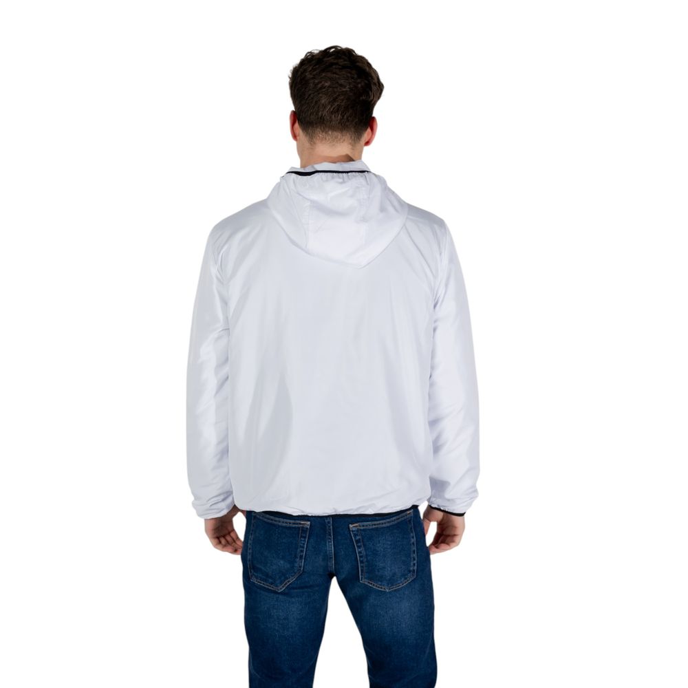 Back view of EA7 Emporio Armani White Polyester Shell Jacket worn by a man, showcasing its lightweight and stylish design.