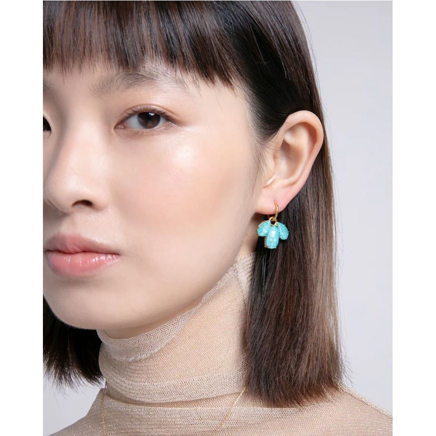 Woman wearing VICEROY JEWELS Mod. 13191E100-93 silver earrings with turquoise stones, showcasing elegant design for ladies.
