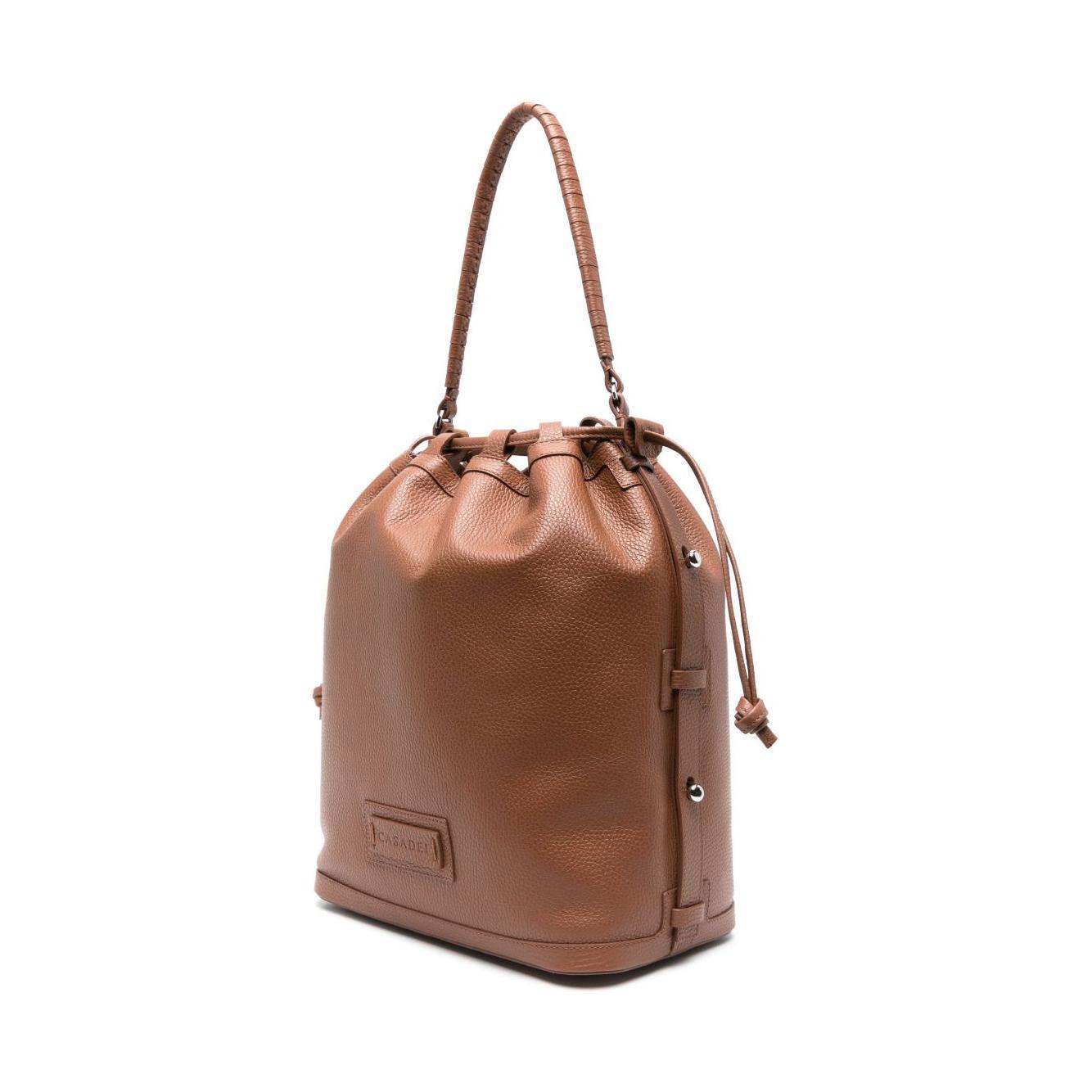 Front view with bag zipped and handles upright.
