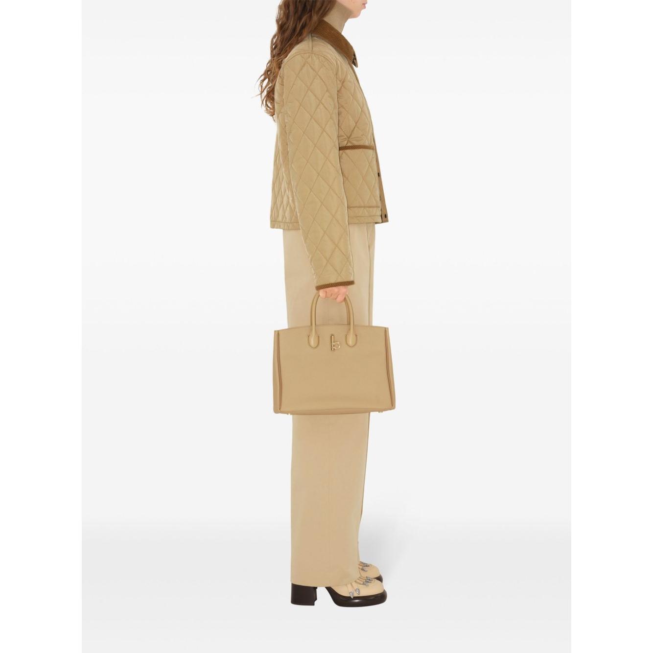 Front view with bag zipped and handles upright.