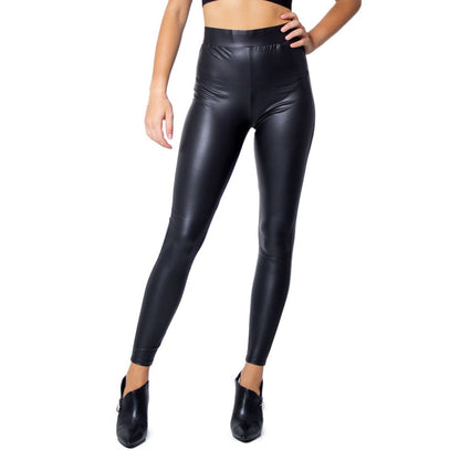 Model wearing Only Black Polyester Leggings with glossy finish, showcasing fitted and stylish design.