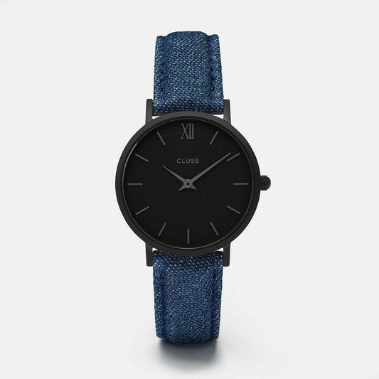 Cluse analog quartz watch with black stainless steel case, blue leather strap, and black dial. Mineral glass, buckle closure, 33mm diameter.
