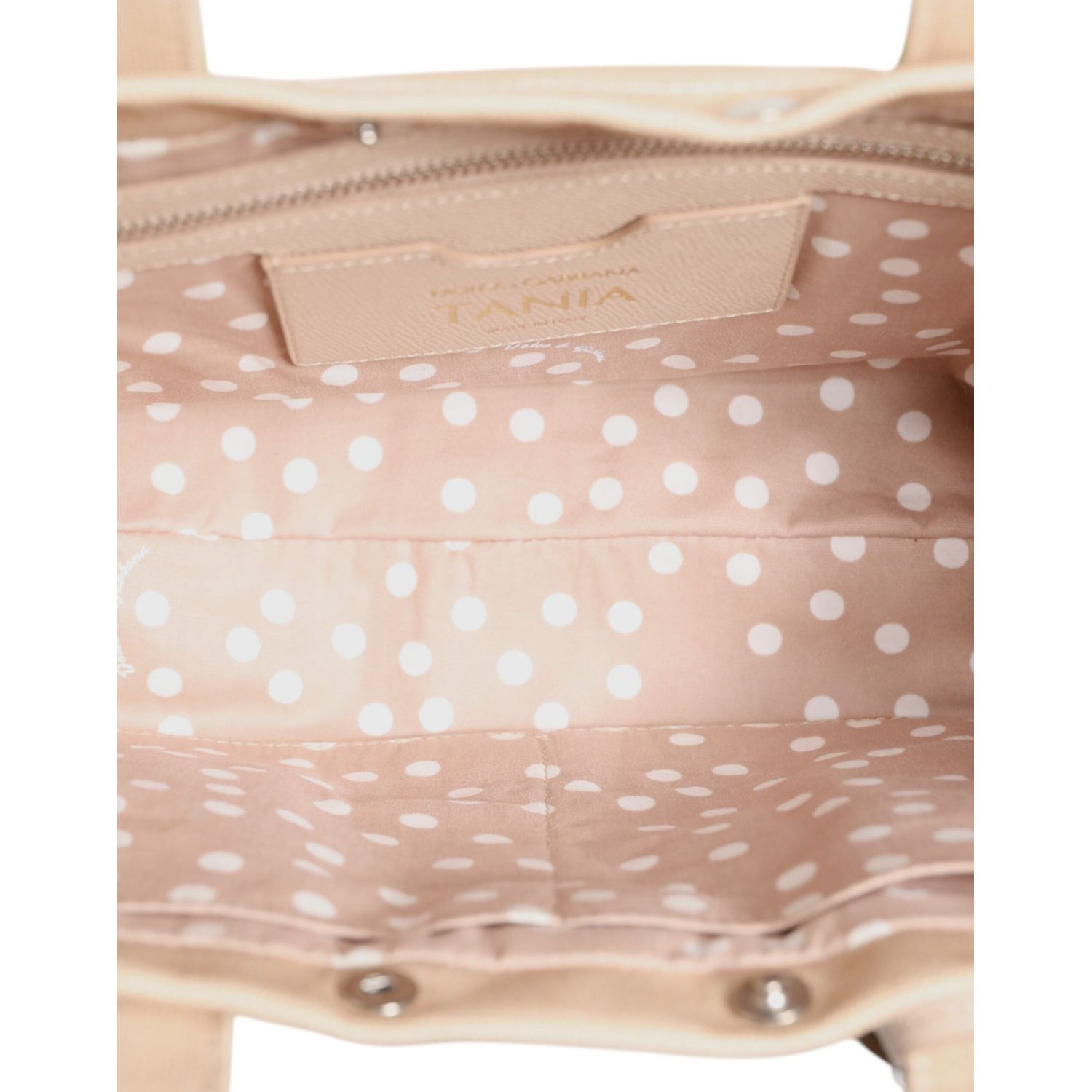 Front view with bag zipped and handles upright.