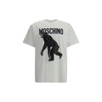 Moschino cotton T-shirt featuring a playful monkey graphic and iconic monogram, offering a casual, distinctive look. SS25 collection.