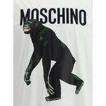 Moschino T-shirt featuring a playful monkey graphic and the iconic monogram on a white cotton fabric, perfect for a casual yet distinctive look.