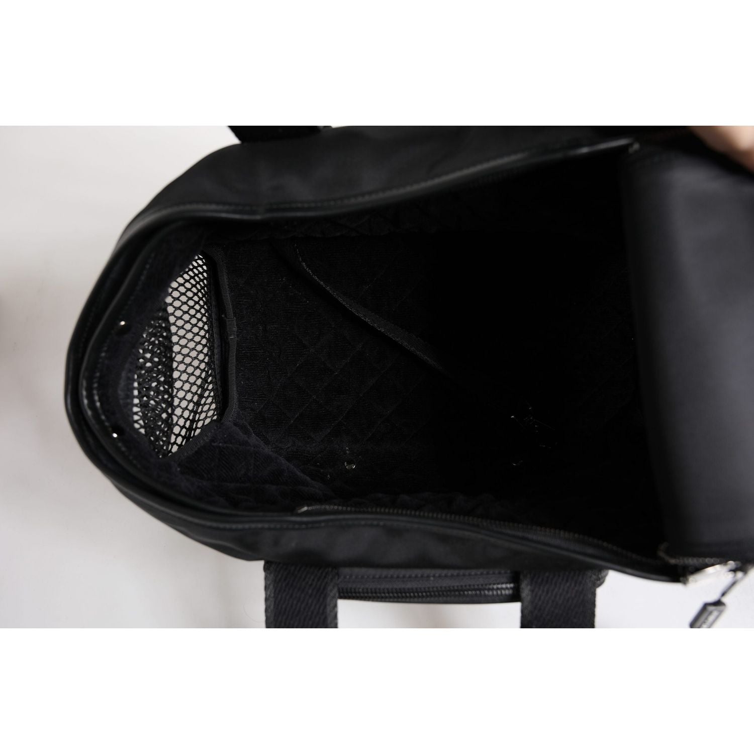 Front view with bag zipped and handles upright.