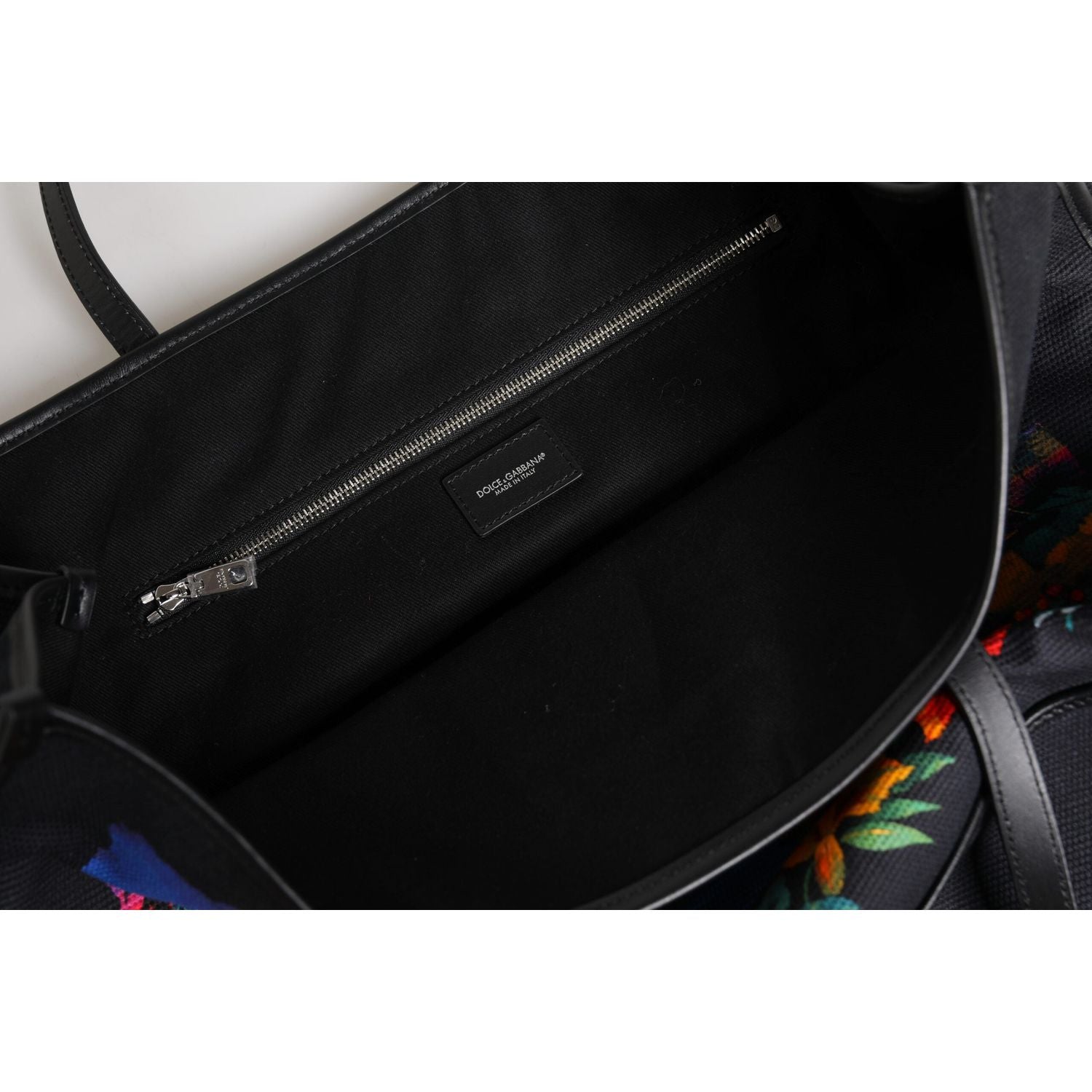 Front view with bag zipped and handles upright.