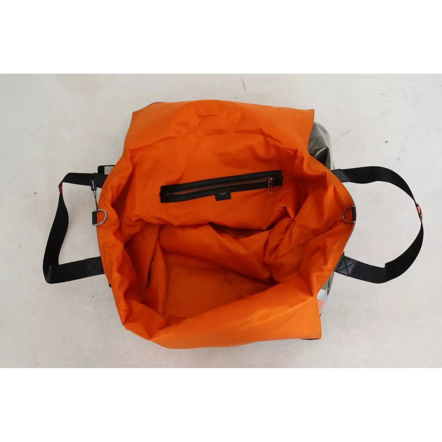 Front view with bag zipped and handles upright.