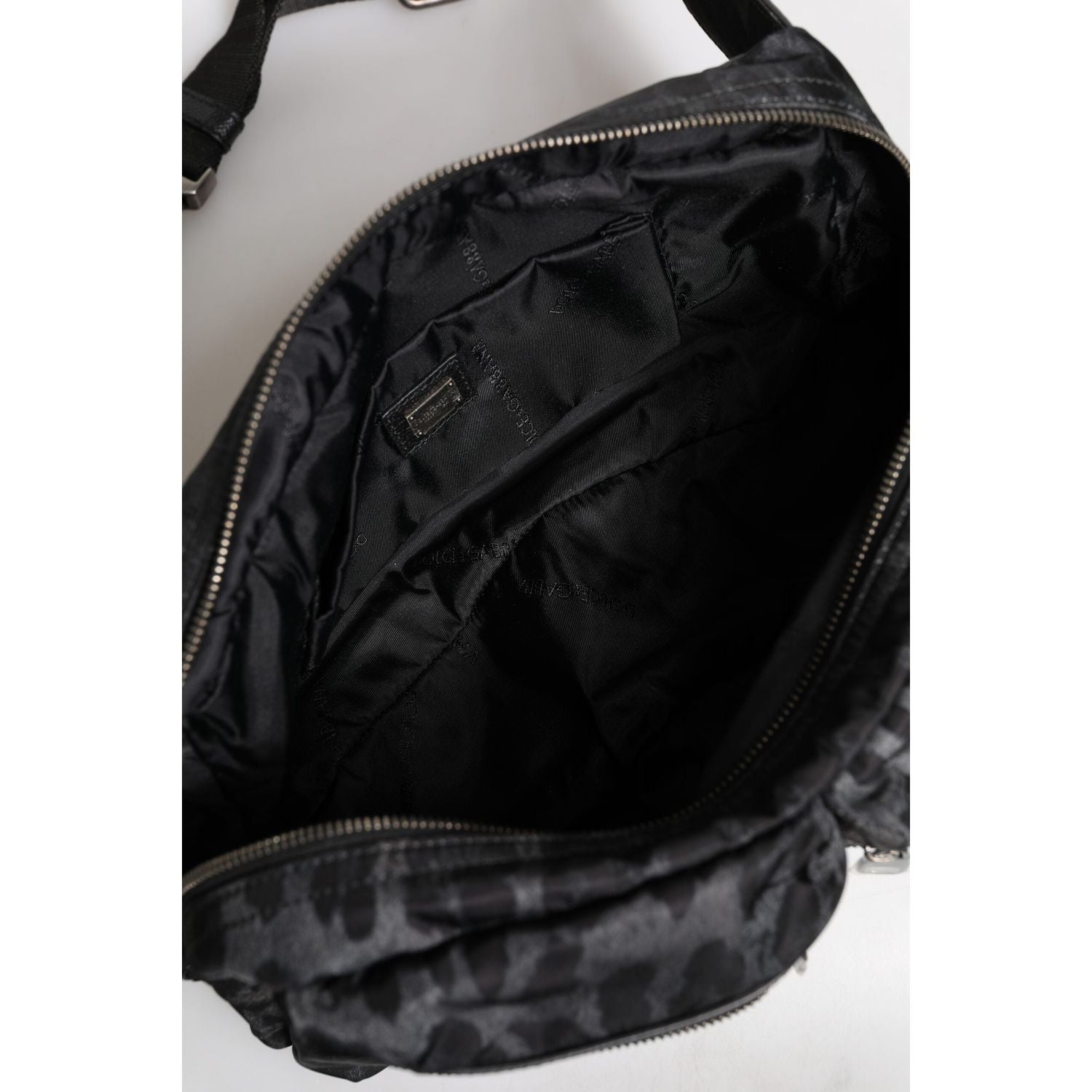 Front view with bag zipped and handles upright.