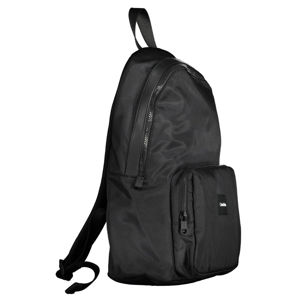 Calvin Klein Black Polyester Men Backpack with bold logo and sleek design, crafted for urban trendsetters, eco-friendly, adjustable straps.