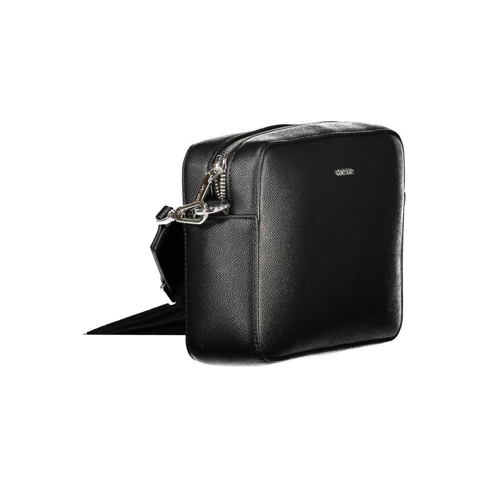 Front view with bag zipped and handles upright.
