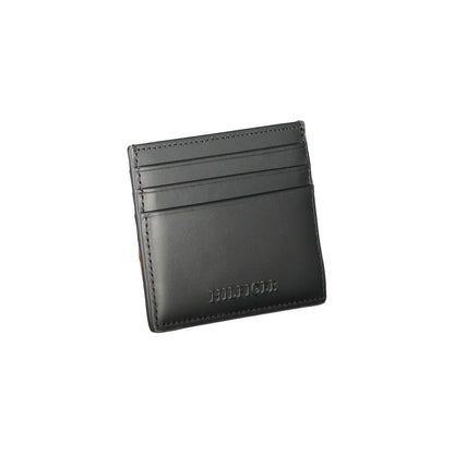 Tommy Hilfiger Black Leather Wallet with card holder, central pocket, and contrast details.