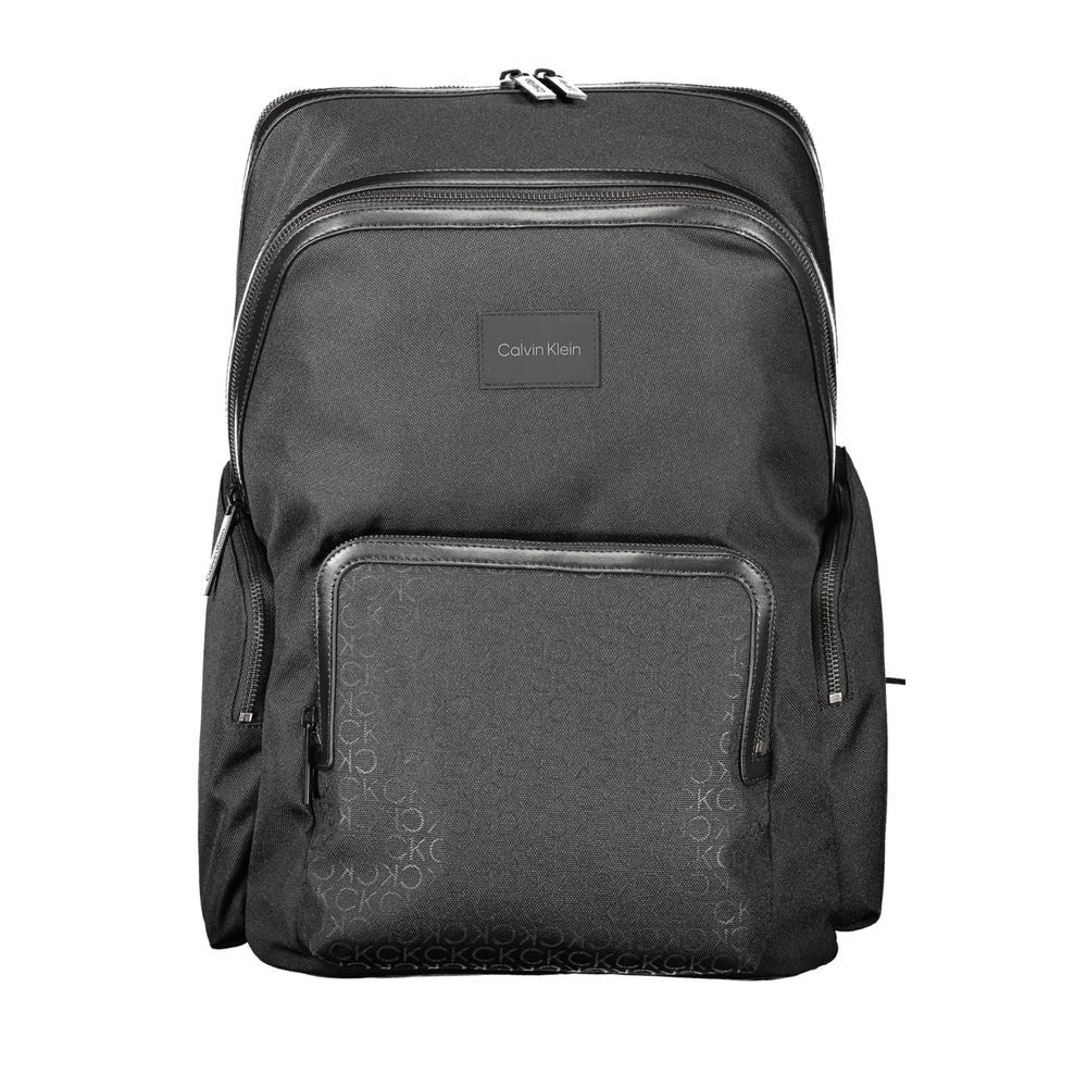 Calvin Klein Black Polyester Backpack with laptop compartment, adjustable straps, and logo, made of 95% recycled material.