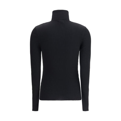 Back view of Wolford Black Fleece Wool Turtleneck, featuring ribbed design and slim fit, made from 100% virgin wool in Italy for AW25.