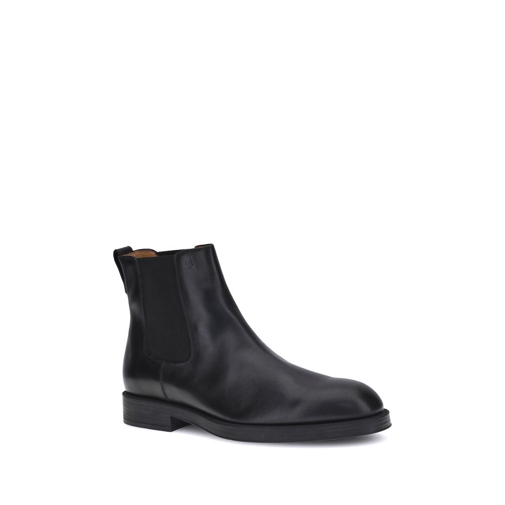 Alt Tag: Tod's Black Calf Leather Bos Taurus Chelsea Boots with elastic side inserts and back tab for ease of fit.