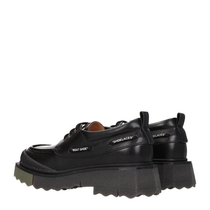 Off-White Black Leather Slip-On Loafers with lace-up design, vintage effect, rubber sole, mid heels, and military green details.