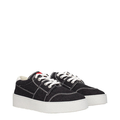 Ami Paris Black Fabric Low Top Sneakers with lace-up closure, round toe, rubber sole, and mid heels. Features white detailing and back logo.