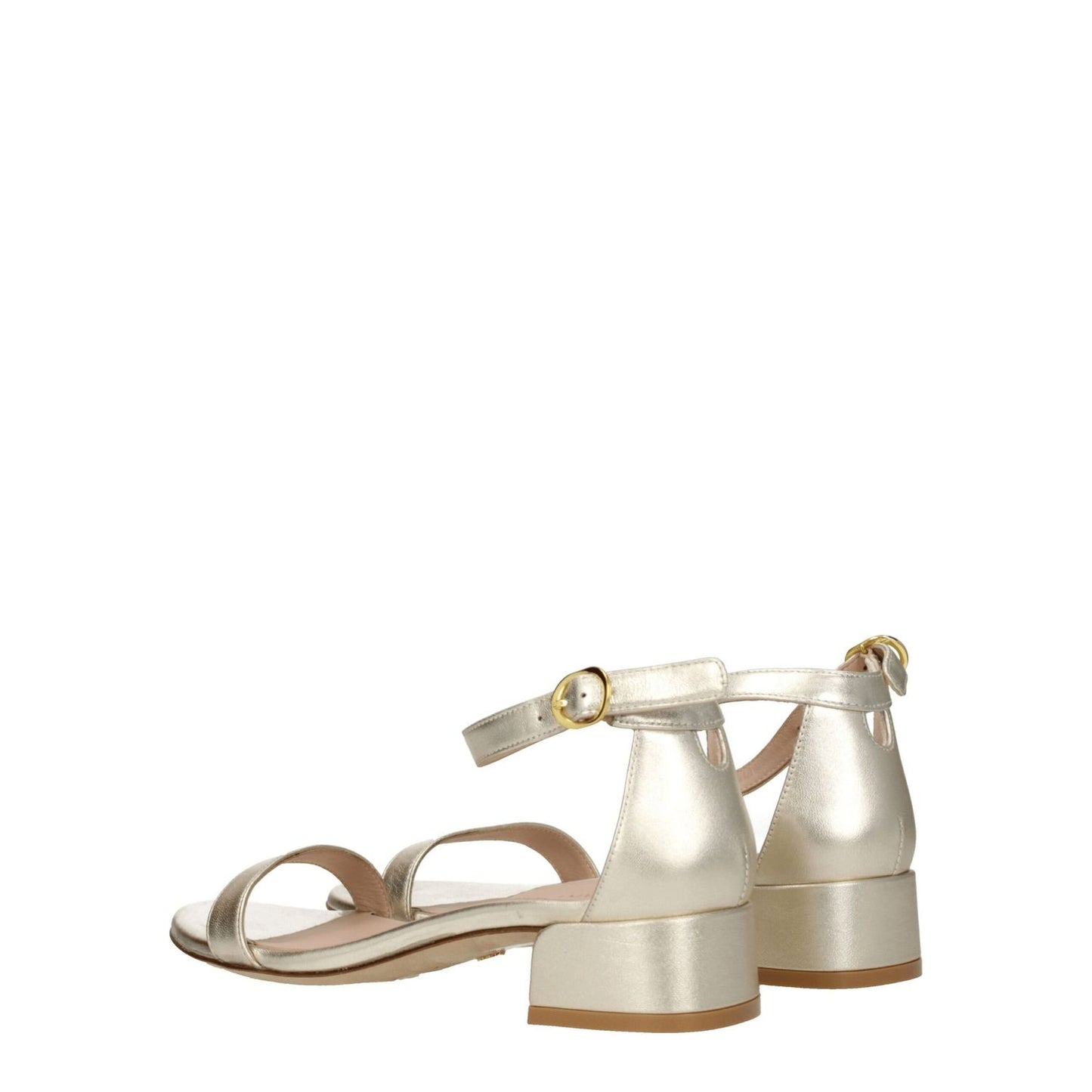 Stuart Weitzman Gold Leather Flat Sandals with open toe and buckle closure, featuring metallic platinum accents and mid heels.