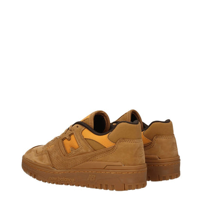 New Balance Brown Leather Sneakers with suede material, aged effect, and side logos, featuring a lace-up closure and rubber sole.