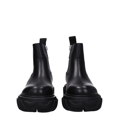 Off-White Black Leather Ankle Boots with side logo and zip closure, featuring rubber sole, mid heels, and round toe design.