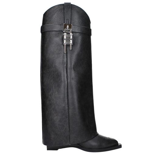 Givenchy Black Leather Boots with aged and vintage effect, side detail, pointy toe, and silver accents. Stylish casual footwear.