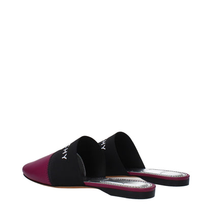 Givenchy Purple Leather Slippers with front logo, low flat heel, round toe, and dark orchid accents, crafted from violet leather.