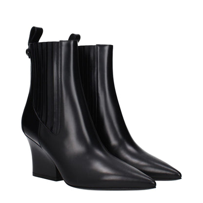 Valentino Garavani Black Leather Ankle Boots with pointy toe and mid heels, featuring a back logo, style for a casual look.