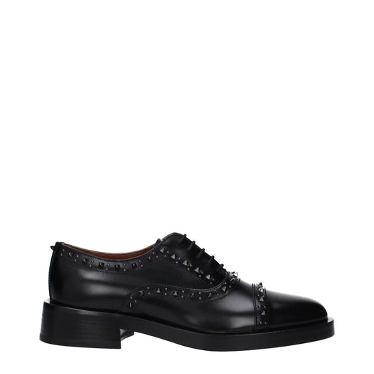 Valentino Garavani Black Leather Oxfords And Derbies with studs, lace-up, monkstrap design, and mid heel, casual style.
