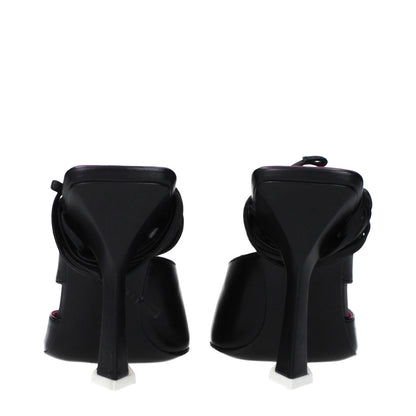 The Attico Black Leather Stiletto Heel Sandals with lace-up closure, high heel, pointy toe, rear view of elegant design.