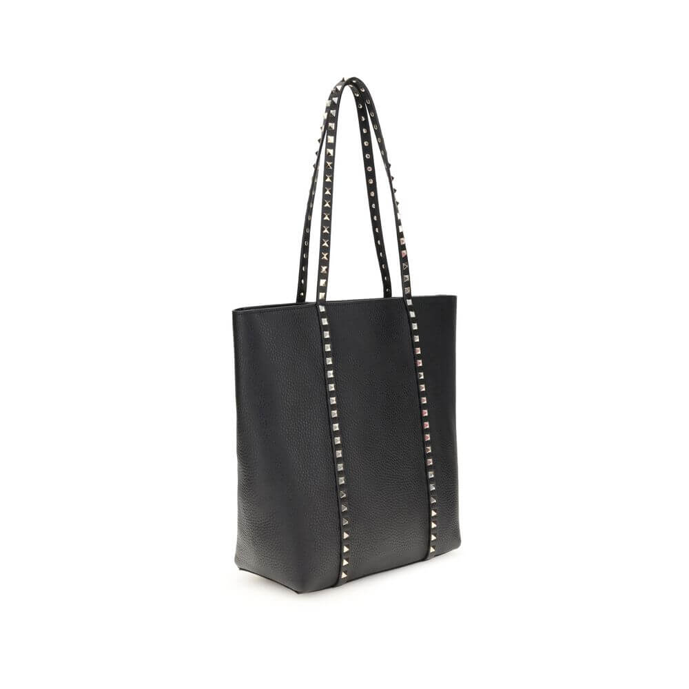 Valentino Garavani Black Calf Leather Bos Taurus Shoulder Bag with platinum studs, elegant tote design and removable pouch.