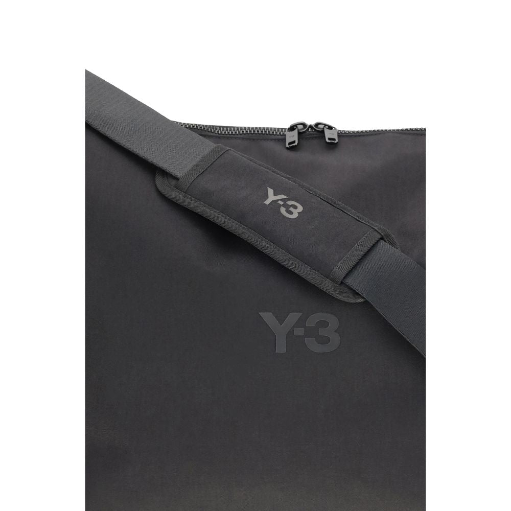 Y-3 Black Polyamide Shoulder Bag with adjustable strap and logo details, featuring a minimalist design. Perfect for daily use and travel.