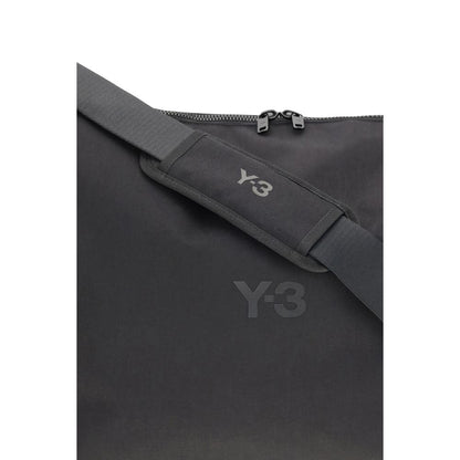 Y-3 Black Polyamide Shoulder Bag with adjustable strap and logo details, featuring a minimalist design. Perfect for daily use and travel.