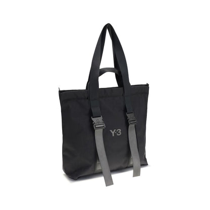 Y-3 Black Nylon Shoulder Bag featuring a sleek design with top handles, zippered closure, and subtle logo detail on a versatile nylon tote.