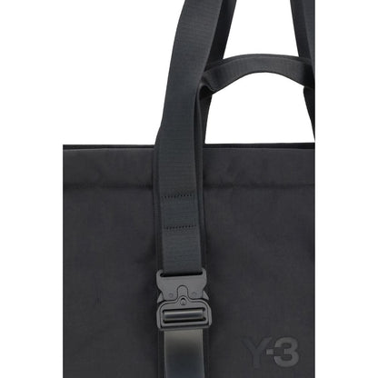 Y-3 Black Nylon Shoulder Bag with top handles and tone-on-tone front logo, showing close-up of design features and fabric texture.