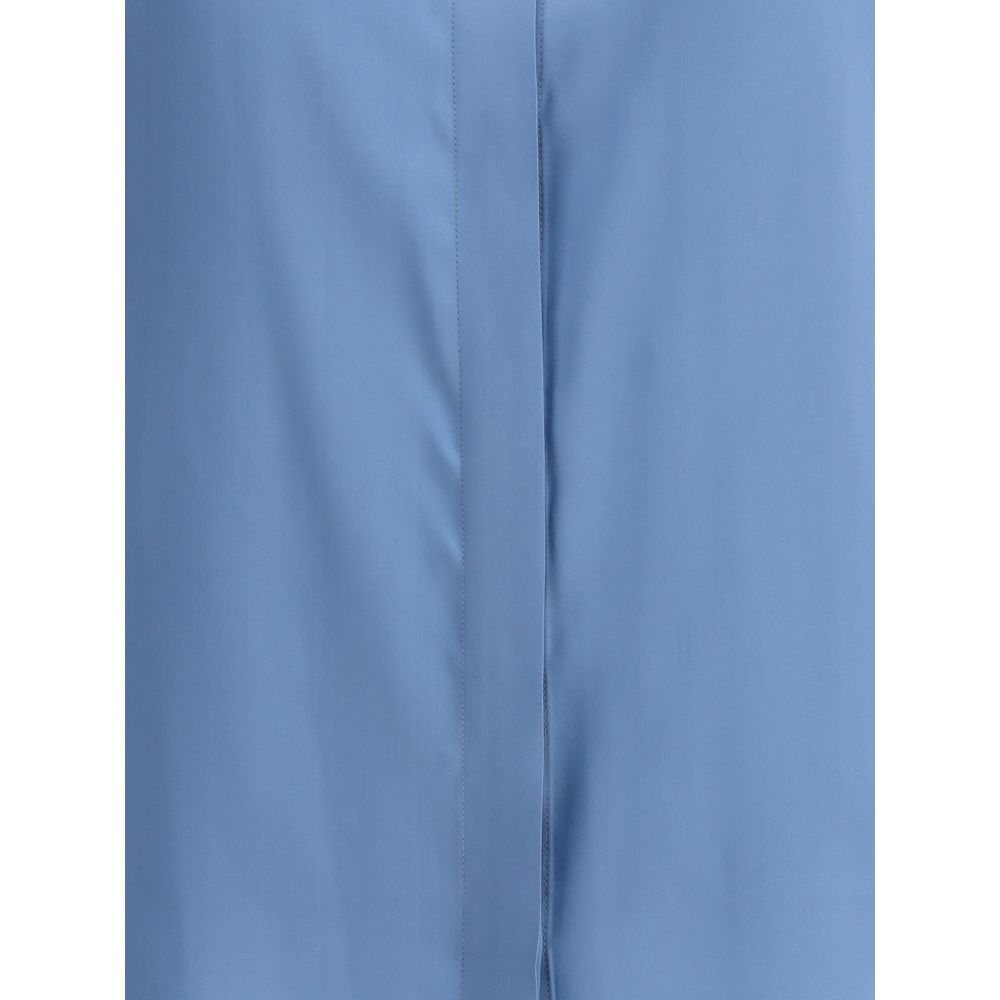 Crida Milano Light Blue Silk Shirt with satin finish and sleek button closure, highlighting the luminous texture and minimalist elegance.