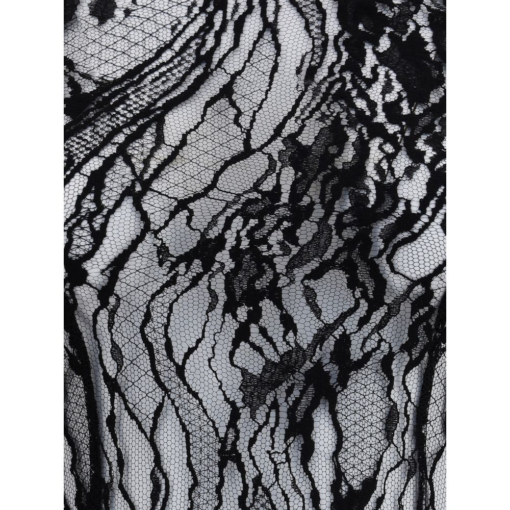 Close-up of sheer lace detail on Balmain Black Cotton Top, highlighting intricate design for a bold feminine look. Season AW25.