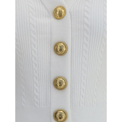 Balmain White Viscose Cardigan with embossed gold buttons and ribbed braiding, showcasing iconic structured design and military inspiration.