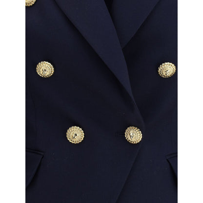 Close-up of Balmain Blue Fleece Wool Blazer with gold embossed buttons and peak lapels, highlighting luxury design.