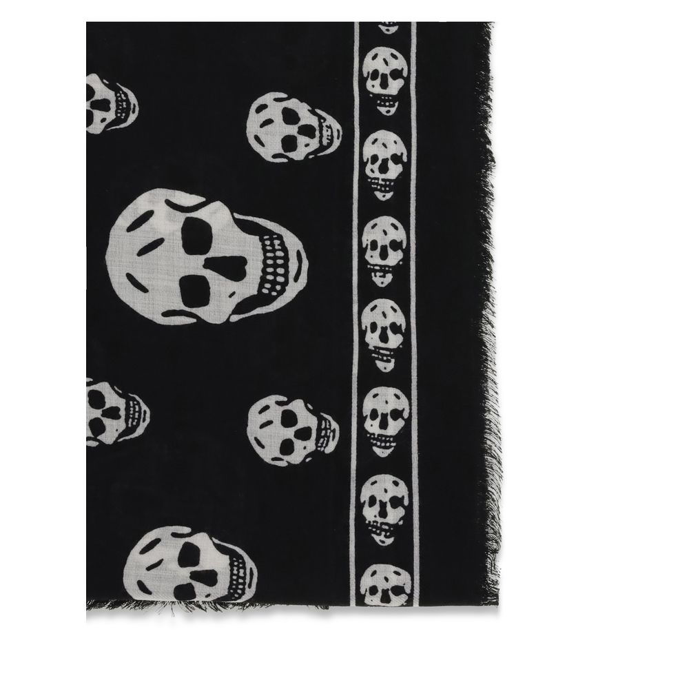 Alexander McQueen Black Modal Scarf featuring skull motifs and fringed edges, made from silk and modal blend, AW25 season accessory.