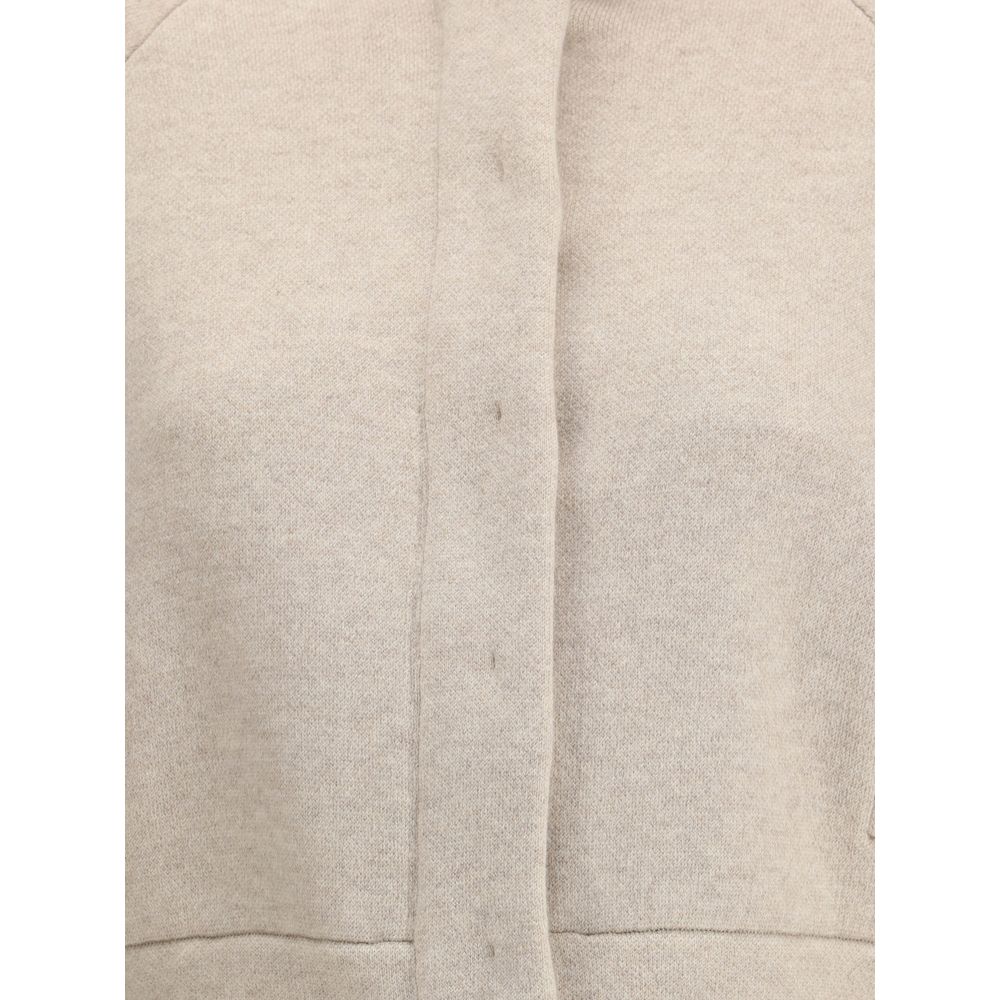 Close-up of Brunello Cucinelli Beige Cashmere Clothing showcasing texture and details.