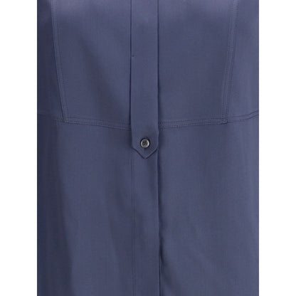 Close-up of Brunello Cucinelli Blue Silk Blouse showcasing button detail and smooth satin fabric.