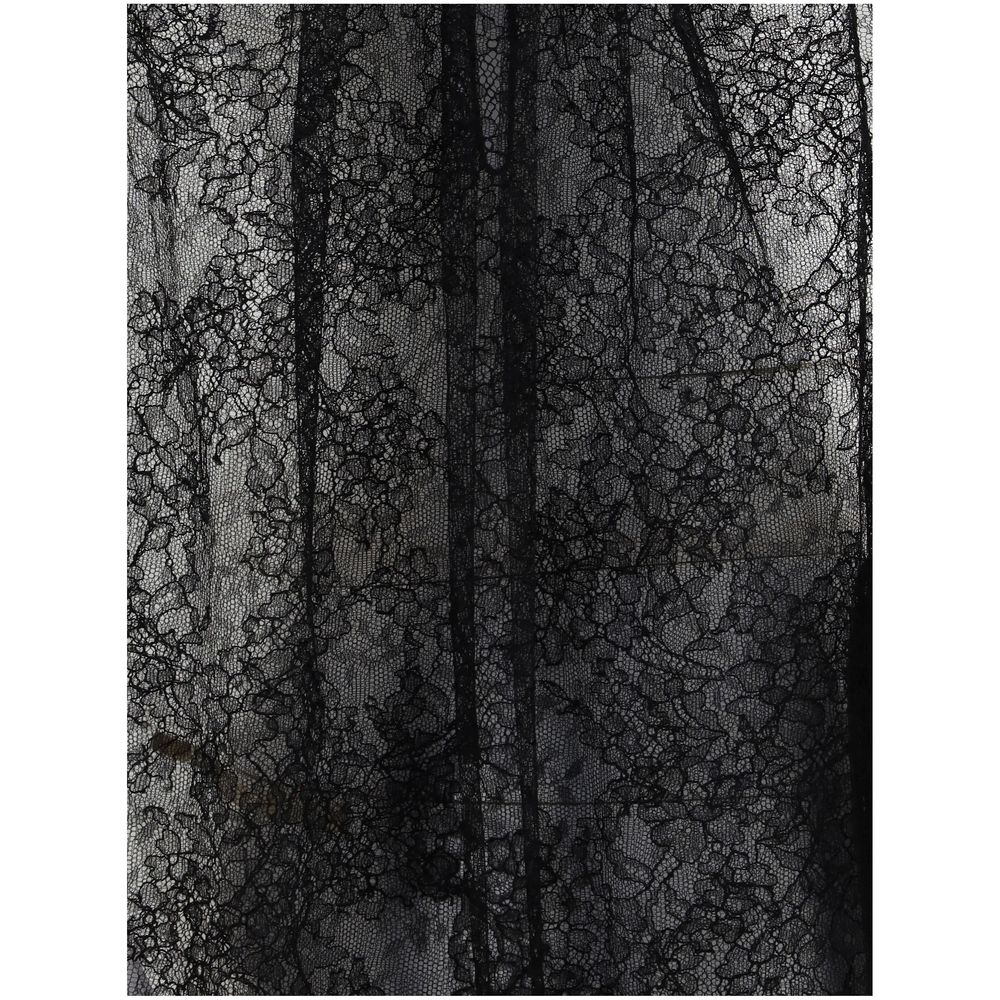 Detailed close-up of black lace fabric from Alexander McQueen Black Polyamide Top featuring intricate patterns, elegant design.