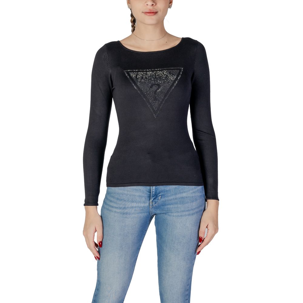 Woman wearing Guess Black Viscose Sportswear sweater with triangle logo and sparkling details, paired with jeans, front view.