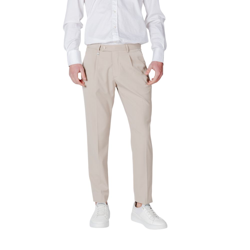 Model wearing Antony Morato Beige Polyester Pant with front pleats and regular fit, styled with white shirt and sneakers.