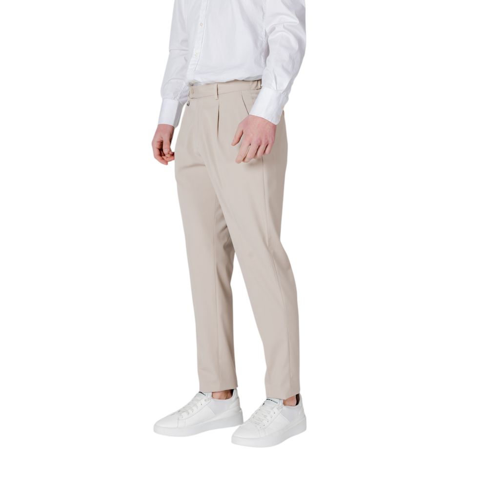 Model wearing Antony Morato Beige Polyester Pant with white shirt and sneakers