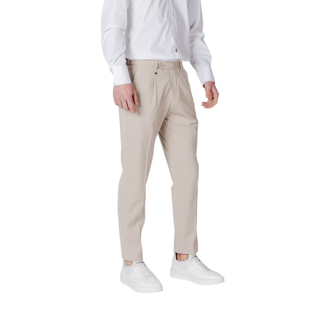 Antony Morato Beige Polyester Pant for men with regular fit, front pleats, and side pockets, styled with white sneakers and shirt.