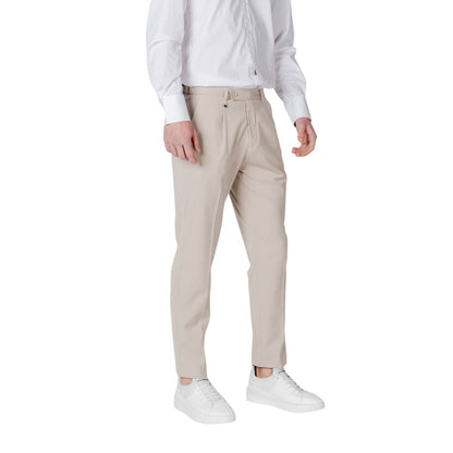 Antony Morato Beige Polyester Pant for men with regular fit, front pleats, and side pockets, styled with white sneakers and shirt.