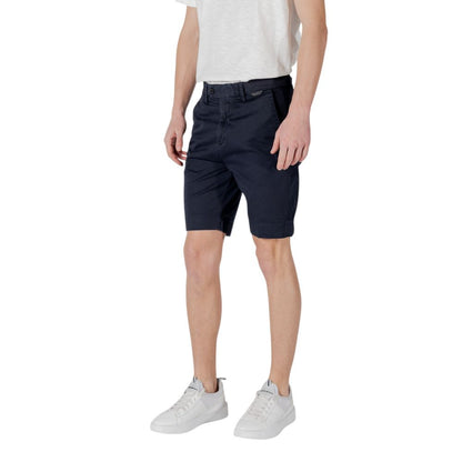 Man wearing Antony Morato Blue Cotton Bermuda Shorts slim fit for summer casual style.