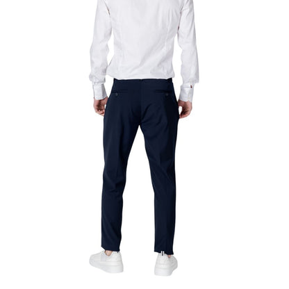 Back view of Antony Morato Blue Polyester Dress Pants with regular fit, paired with white shirt and sneakers.