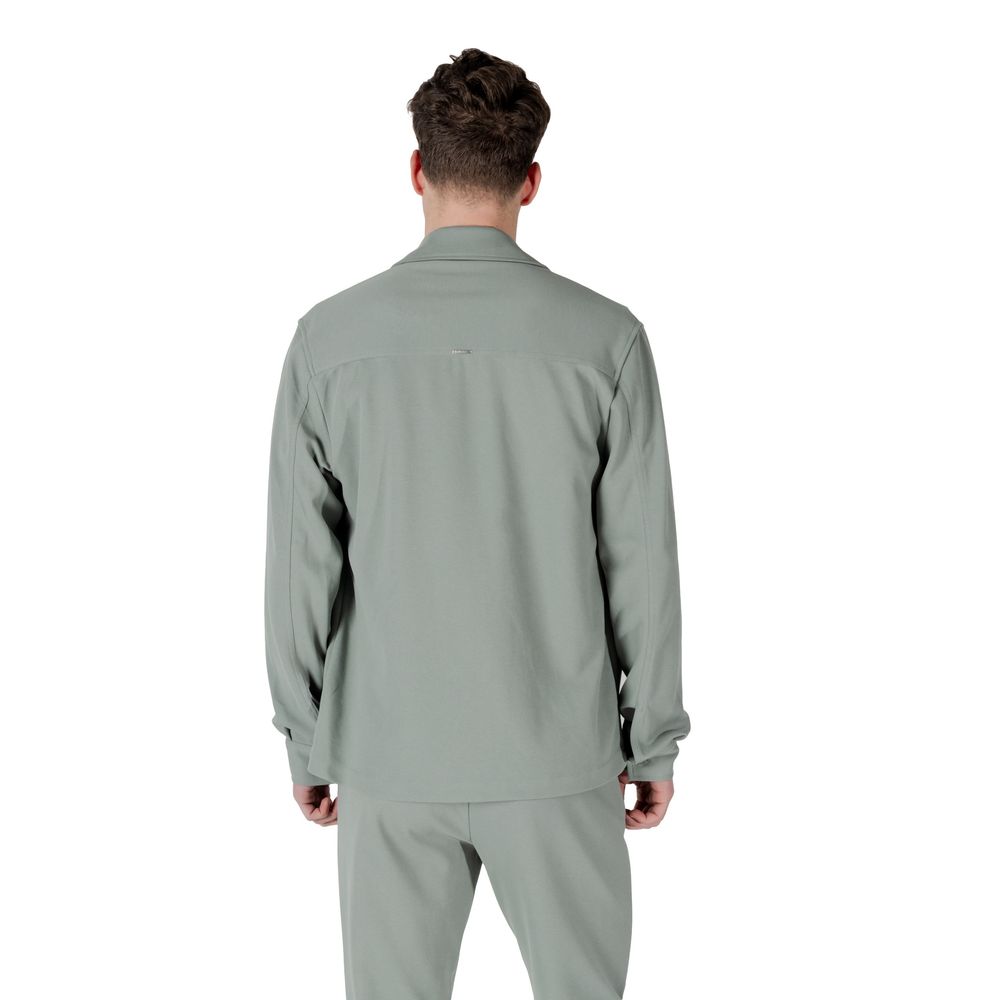 Back view of model wearing Antony Morato Green Polyester Shirt, showcasing long sleeves and straight fit design for versatile style.